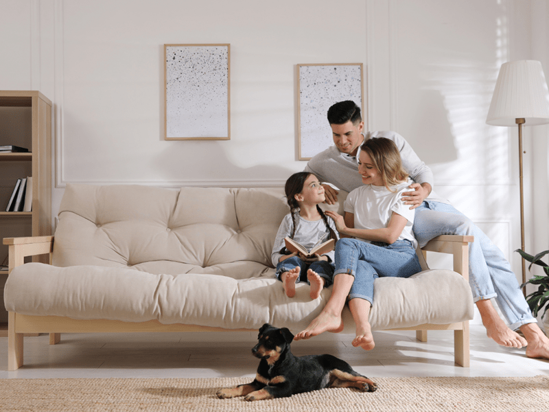 Family on couch heating and cooling upgrade