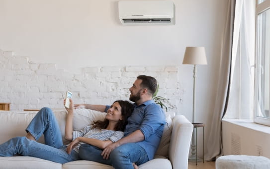 couple under an Air-conditioner.